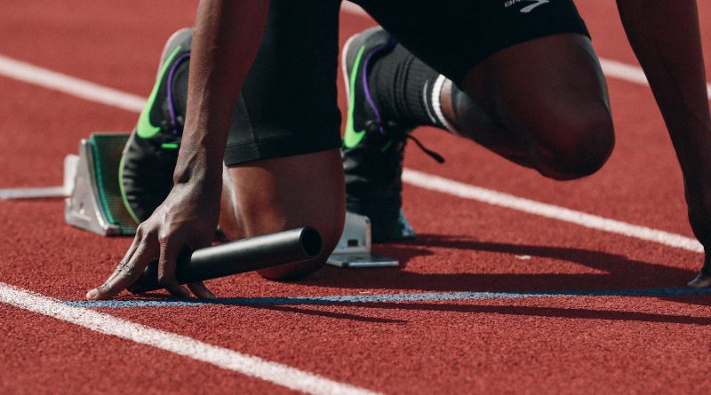 man on running field