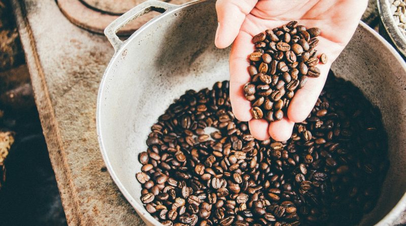 coffee beans on gray steel wok