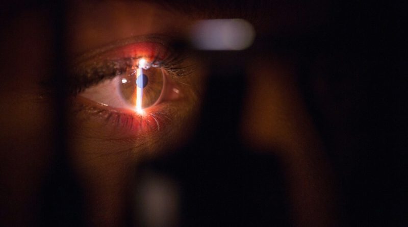 person with lighted cigarette in mouth