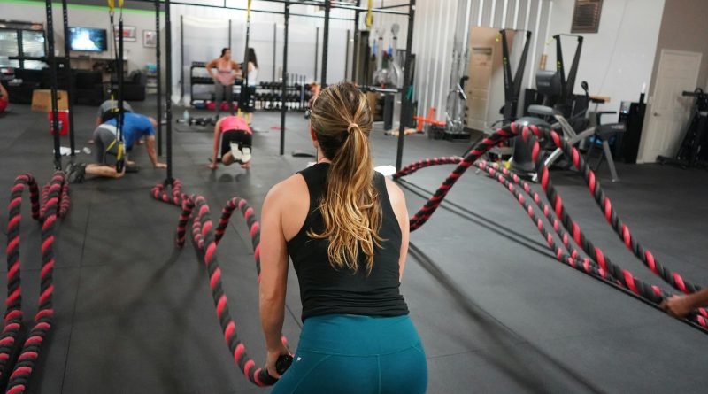 woman in black top pulling rope