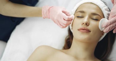 Woman enjoying a soothing facial treatment in a serene spa setting, promoting relaxation and beauty.