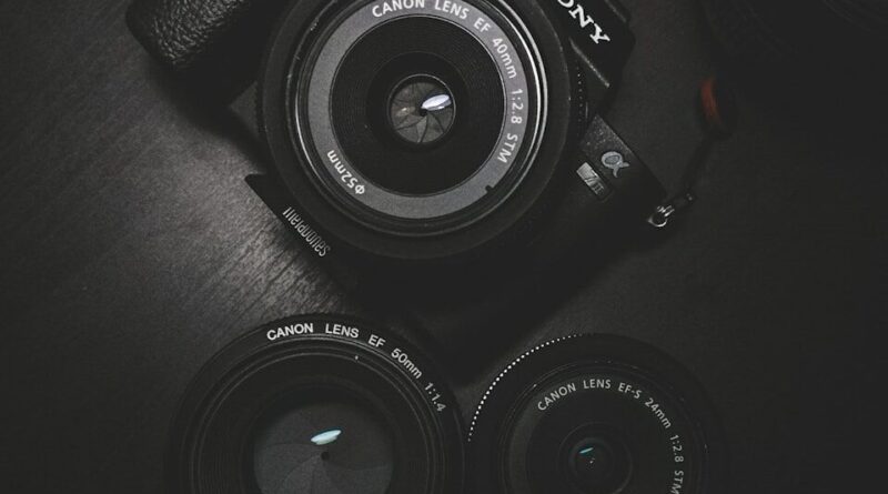 flat lay photography of black Sony DSLR camera on black surface