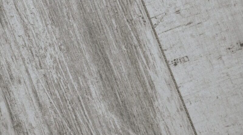 a black and white photo of a skateboard on the ground